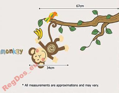Naklejki Figlująca małpka na gałęzi drzewo MONKEY